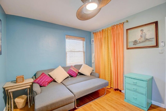 living room featuring baseboards and wood finished floors