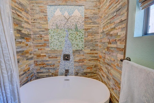 bathroom featuring radiator and a bathing tub