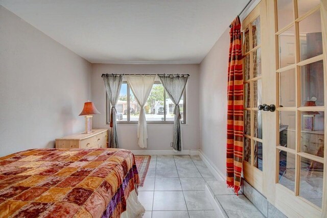 bedroom featuring light tile patterned flooring