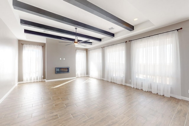 unfurnished living room with beam ceiling, ceiling fan, and light hardwood / wood-style flooring