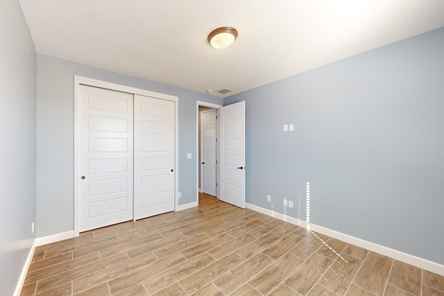 unfurnished bedroom with a closet