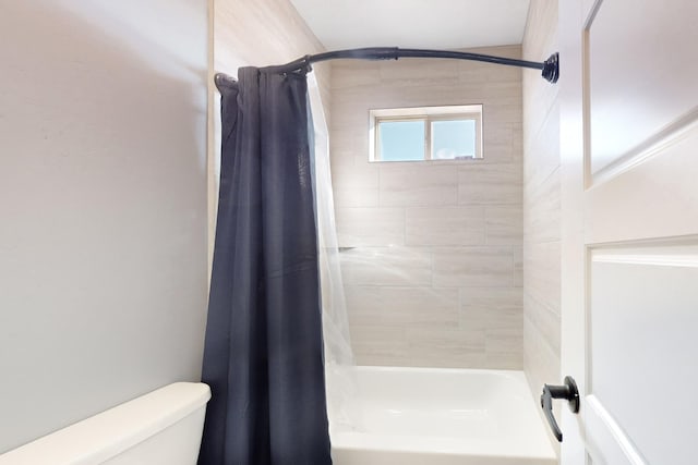 bathroom with toilet and shower / bathtub combination with curtain