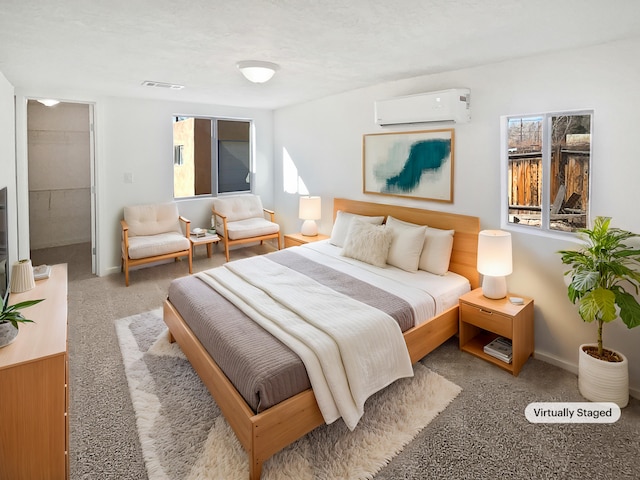 carpeted bedroom with a wall mounted air conditioner