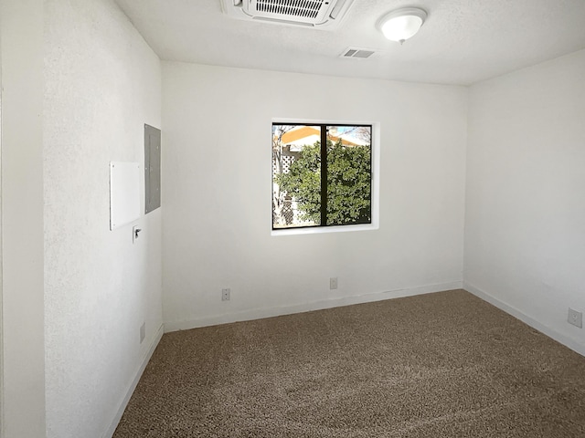 unfurnished room with carpet floors and electric panel