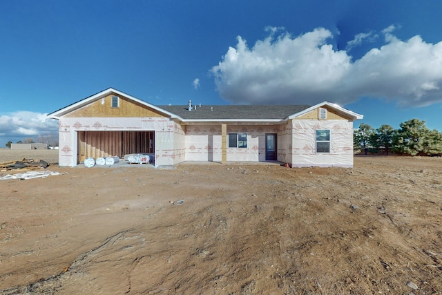 property in mid-construction featuring an attached garage