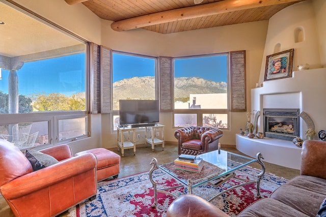 living room with wood ceiling and beamed ceiling