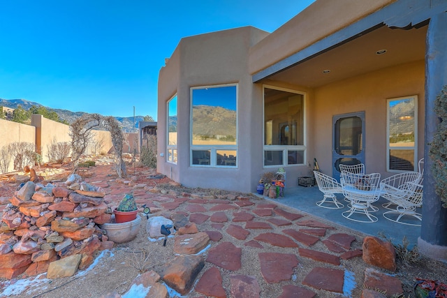 view of patio / terrace with a mountain view