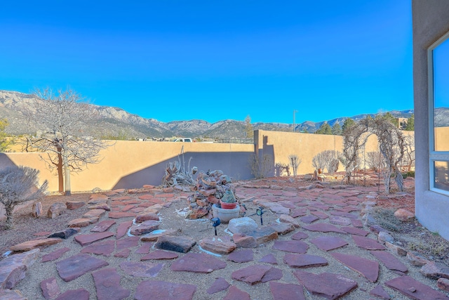 view of patio / terrace featuring a mountain view