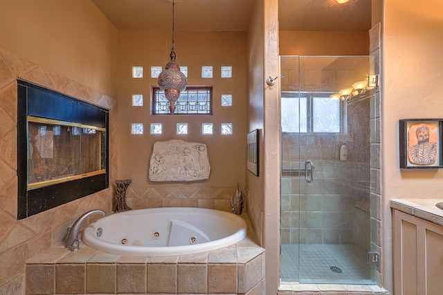 bathroom with vanity and separate shower and tub