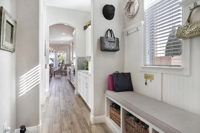 mudroom with a chandelier