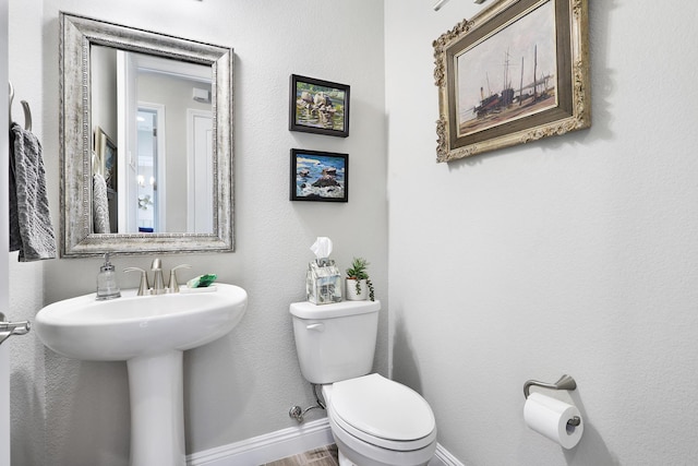 bathroom with toilet and sink