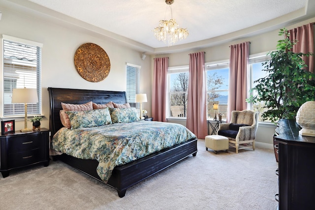 carpeted bedroom with a chandelier