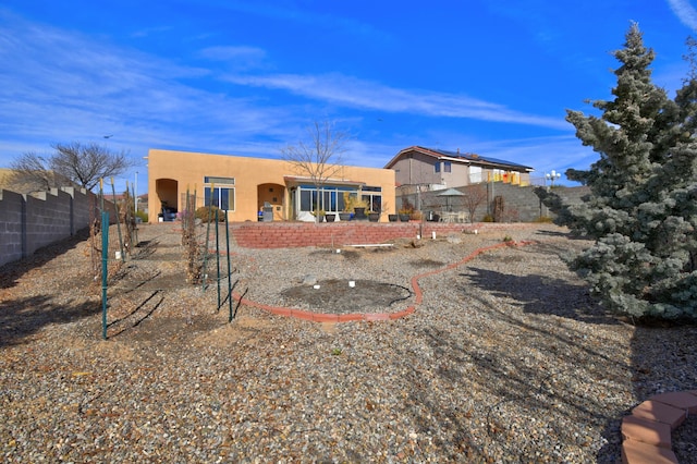 back of property with a patio area