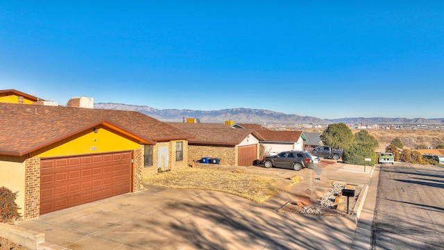 ranch-style home featuring a mountain view