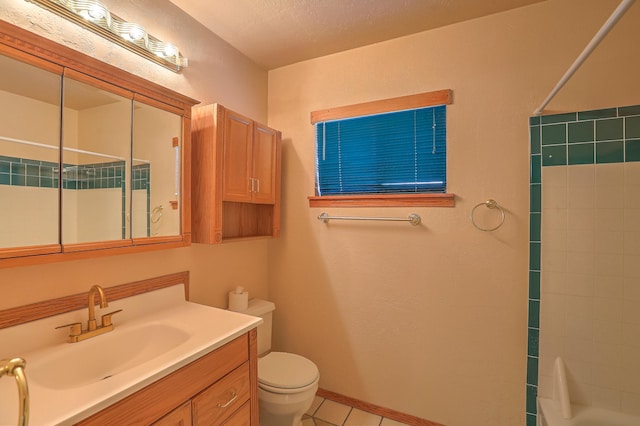 full bathroom with vanity, tile patterned floors, washtub / shower combination, and toilet