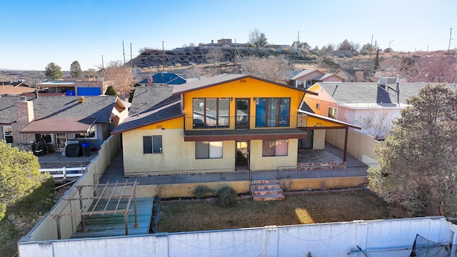 view of front of property with a balcony