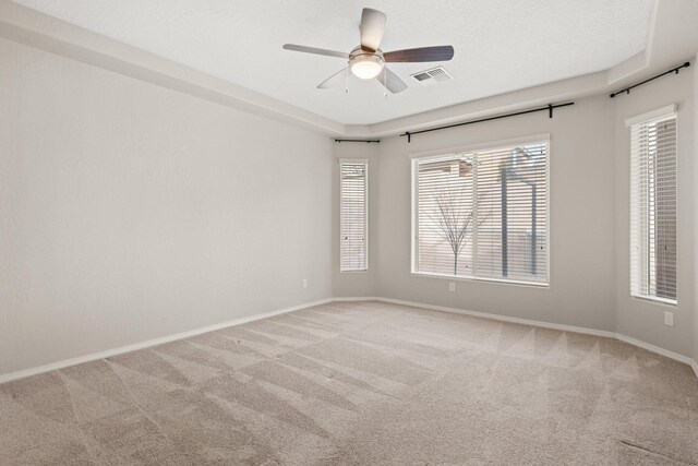 unfurnished room with carpet, a textured ceiling, and ceiling fan