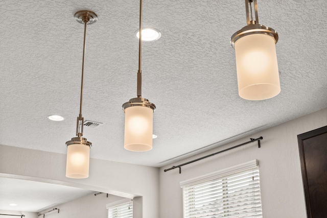 interior details with a textured ceiling