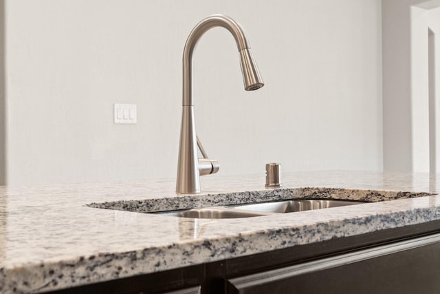 interior details with sink and light stone counters