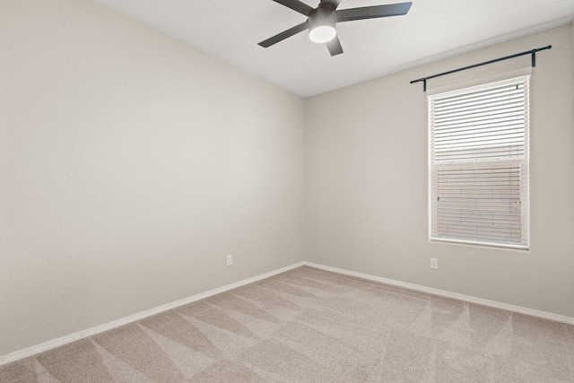 carpeted empty room with a textured ceiling and ceiling fan