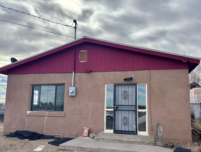 exterior space with stucco siding