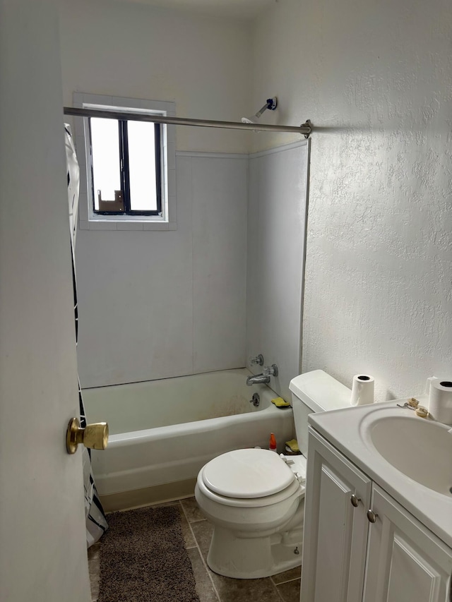 bathroom with shower / bathtub combination, a textured wall, toilet, vanity, and tile patterned floors