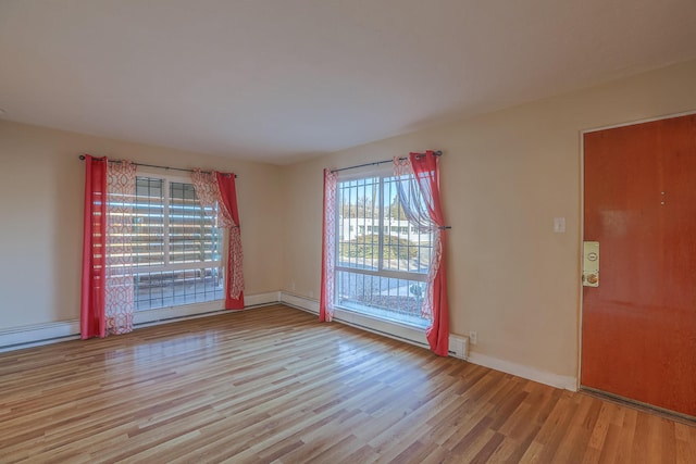 spare room featuring light wood-type flooring