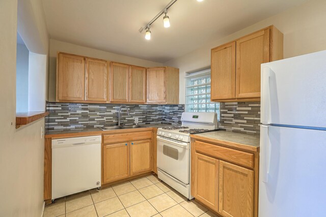 kitchen featuring a baseboard radiator, backsplash, light tile patterned flooring, white appliances, and baseboards