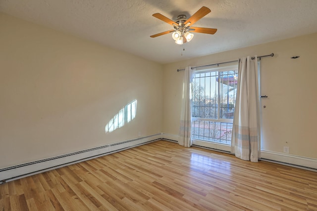 unfurnished room featuring a baseboard heating unit, a textured ceiling, a ceiling fan, and light wood-style floors