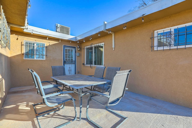 view of patio / terrace featuring central AC unit and outdoor dining space