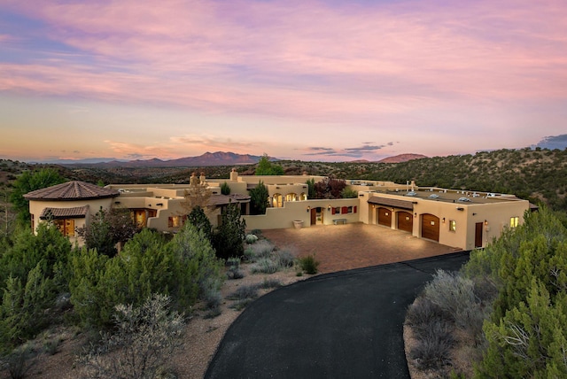 exterior space featuring a garage and a mountain view