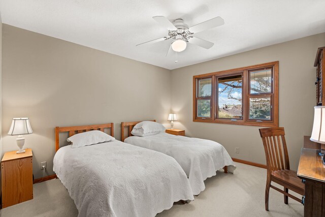 bedroom with carpet, baseboards, and ceiling fan