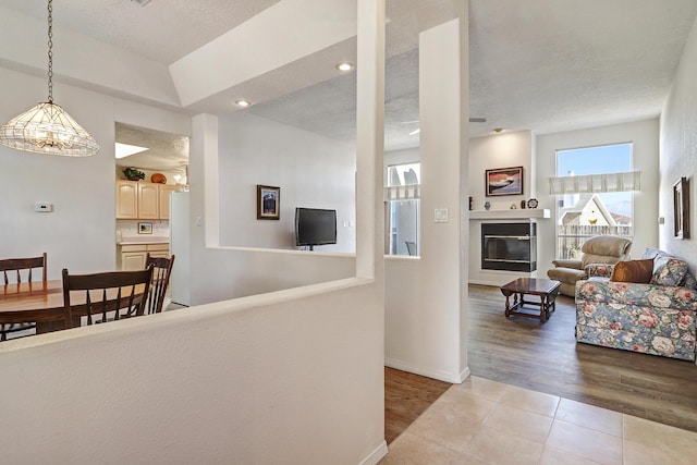 living room featuring light tile patterned floors and a textured ceiling