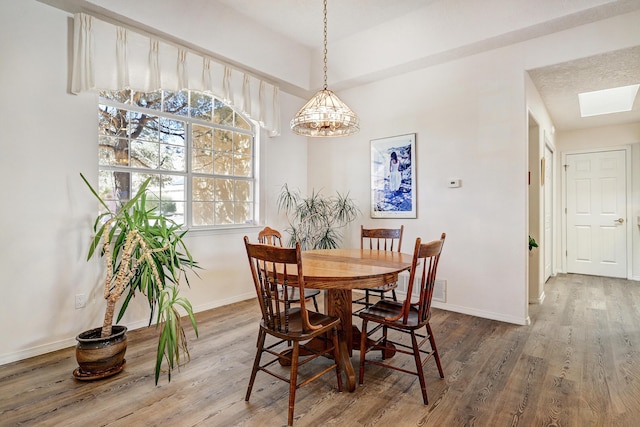 dining area with wood-type flooring