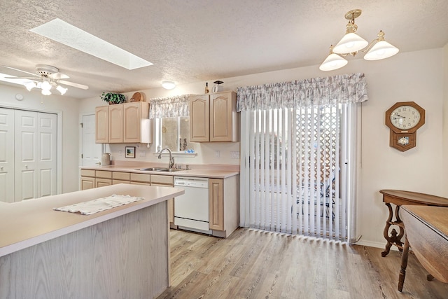 kitchen featuring sink, hanging light fixtures, white dishwasher, light hardwood / wood-style floors, and light brown cabinetry