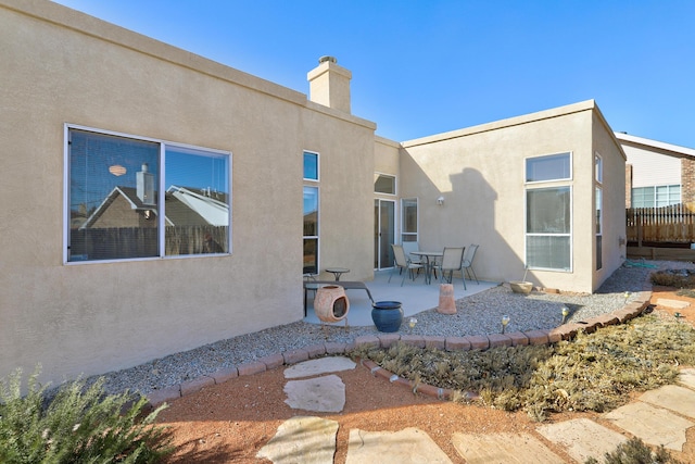 rear view of house featuring a patio