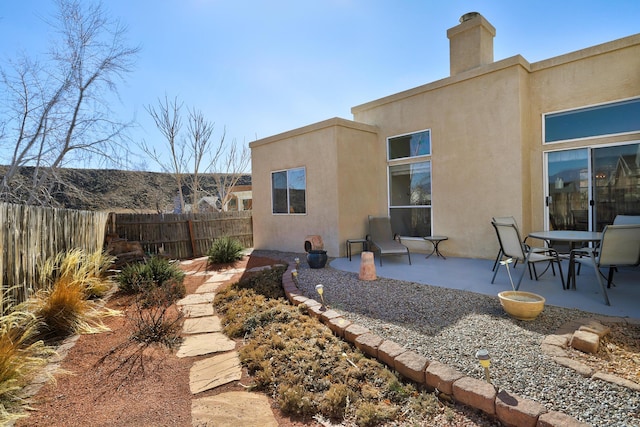 back of property featuring a patio area