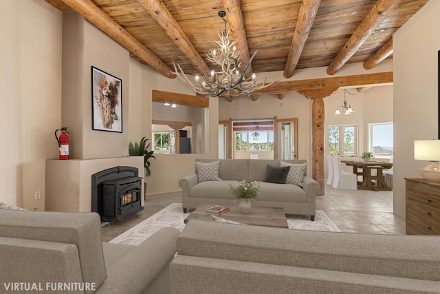 22 Del Charro Rd, Lamy, NM 87540 - living room featuring wood ceiling, beam ceiling, an inviting chandelier, and a wood stove