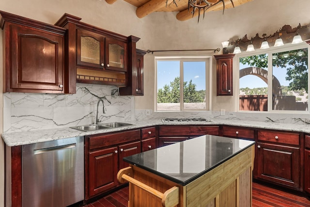 22 Del Charro Rd, Lamy, NM 87540 - kitchen with sink, tasteful backsplash, appliances with stainless steel finishes, dark stone counters, and beam ceiling