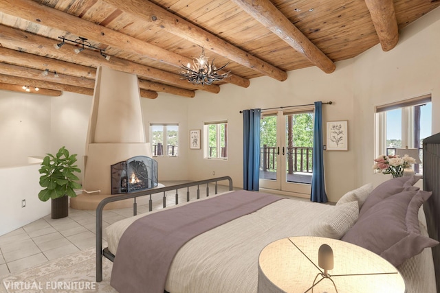 22 Del Charro Rd, Lamy, NM 87540 - tiled bedroom with beam ceiling, a fireplace, wood ceiling, and multiple windows