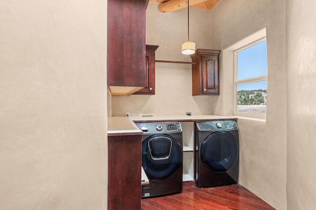 22 Del Charro Rd, Lamy, NM 87540 - laundry area featuring cabinets, washing machine and dryer, and dark hardwood / wood-style floors