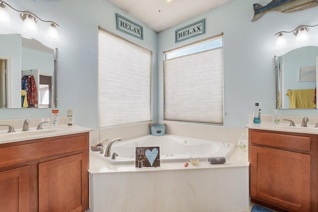 bathroom featuring vanity and a tub