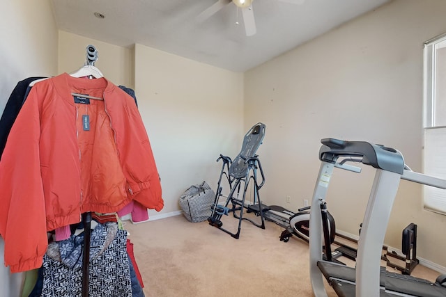 exercise area with light colored carpet and ceiling fan