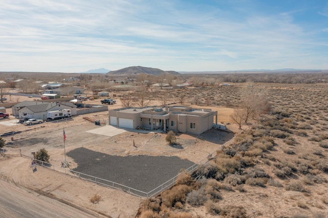 birds eye view of property featuring a mountain view