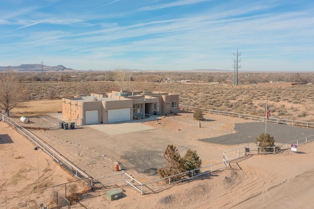 birds eye view of property with a mountain view