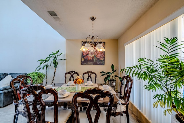 dining room with a chandelier