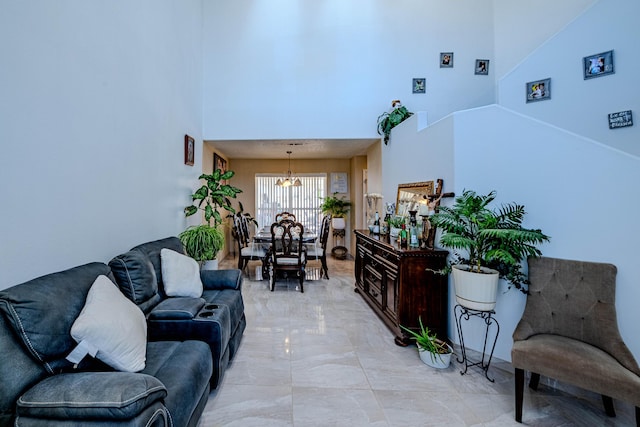 living room featuring a towering ceiling