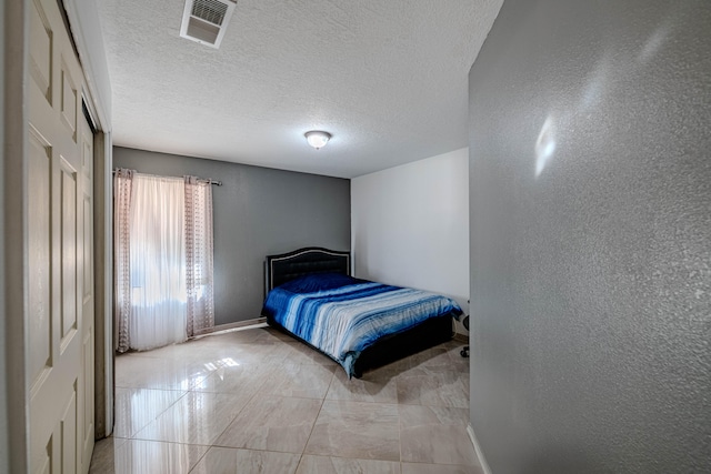 bedroom with a textured ceiling