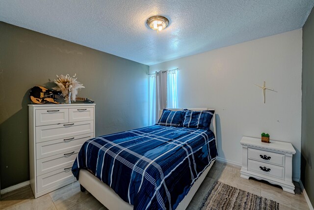 bedroom featuring a textured ceiling