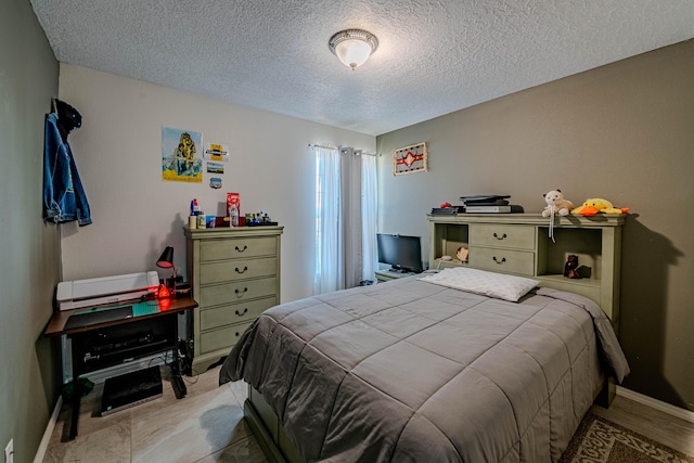 bedroom featuring a textured ceiling